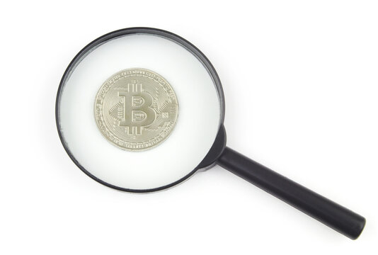 Magnifying glass and bitcoin coin isolated on white background. Bitcoin expertise and review