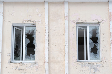 Two plastic windows with broken glass