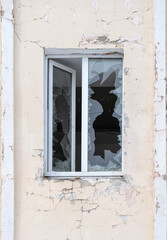 Fototapeta na wymiar Window after the explosion, vertical photo