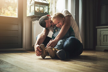 Hell always be showered in love. Shot of a father bonding with his son at home. - obrazy, fototapety, plakaty