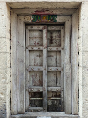 21 March 2022, Pandharpur, India, Old Vintage wooden door on retro wall, Pandharpur, India.