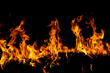 Fototapeta na wymiar Fire flames isolated on black background. Fire burn flame isolated, flaming burning art design concept with space for text.