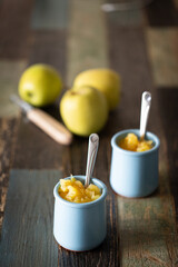 Homemade yogurt with apple jam. Front view.