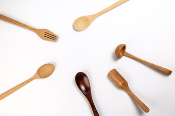 Varity of wooden metal plastic spoon kitchen tableware on white background copy text space