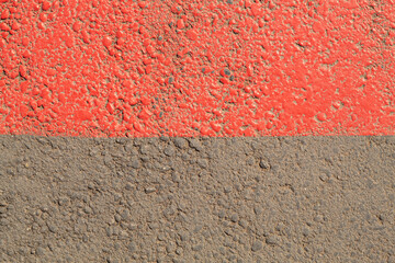Half red half brown painted concrete wall