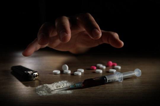 Stop drug addiction concept International Day against Drug syringe and cooked heroin on spoon.
