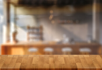 Wood table with blur  in coffee shop cafe For montage product display table copy space cafe background with copy space for text