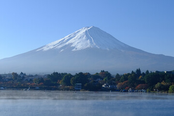 Beautiful mountain Fuji with snow and lake with clear sky background at Kawaguchiko lake in Japan. Mt Fuji is one of famous mountain.