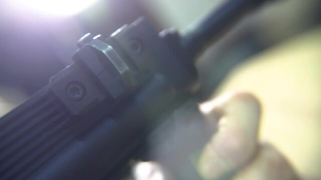 Disassemble and reload weapons close-up. A soldier disassembles a weapon.