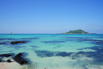 clear bluish water and island