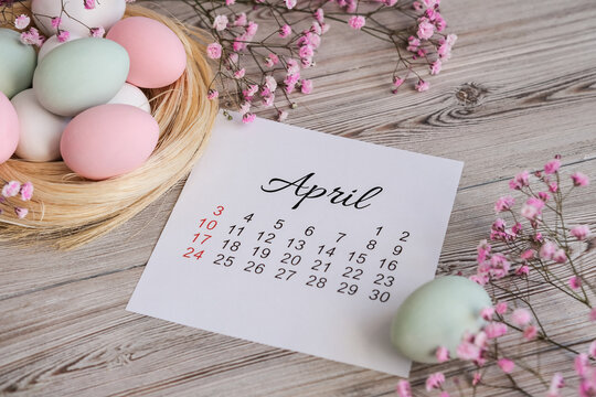 April calendar and Easter nest with eggs in soft pastel colors