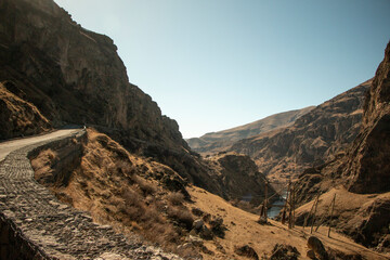 Mountains in Georgia. Landscape of mountains in summer. Blue skies and sun-drenched rocks.