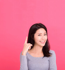  Beautiful asian woman hand pointing fingers up