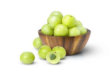Indian gooseberry fruits or Amla (phyllanthus emblica) in wooden bowl isolated on white background.
