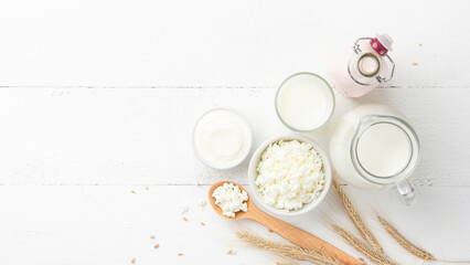 Organic dairy products on a white wooden background
