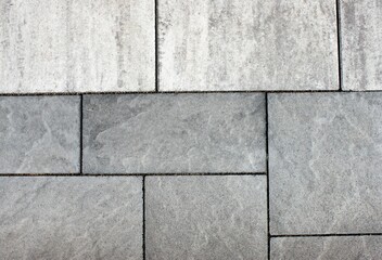 Rectangular gray stone slabs with joints