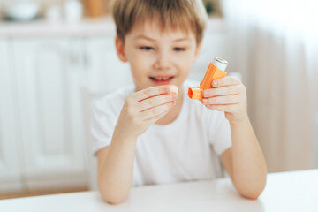 Fototapeta premium Little boy playing with an inhaler.