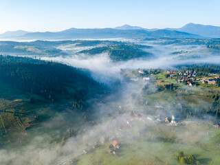 Morning fog in the Ukrainian Carpathians. Aerial drone view.