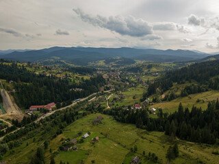 Naklejka premium Settlement in the mountains of the Ukrainian Carpathians. Aerial drone view.
