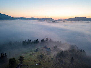 Morning fog in the Ukrainian Carpathians. Aerial drone view.