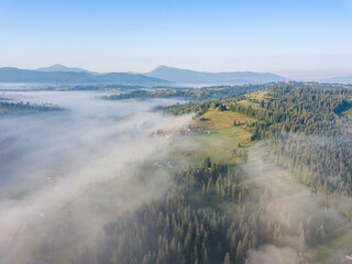 Morning fog in the Ukrainian Carpathians. Aerial drone view.
