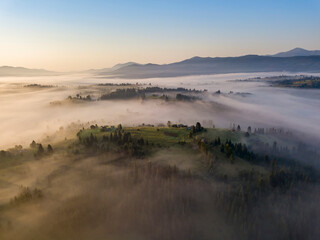Morning fog in the Ukrainian Carpathians. Aerial drone view.