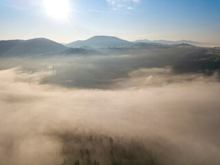 Morning fog in the Ukrainian Carpathians. Aerial drone view.