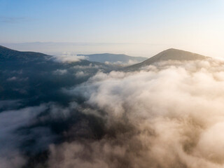 Morning fog in the Ukrainian Carpathians. Aerial drone view.