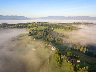 Morning fog in the Ukrainian Carpathians. Aerial drone view.