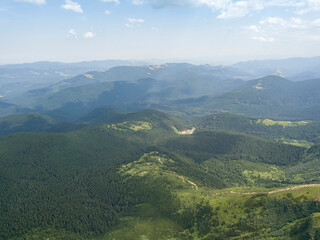 Fototapeta premium High mountains of the Ukrainian Carpathians in cloudy weather. Aerial drone view.