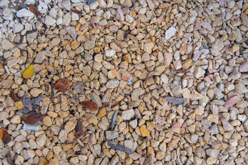 a lot of colored gravel and pebbles lie