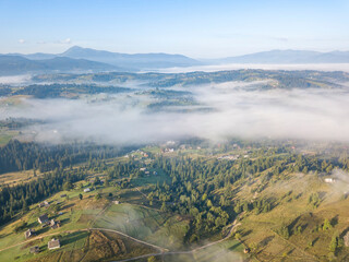 Morning fog in the Ukrainian Carpathians. Aerial drone view.