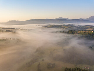 Morning fog in the Ukrainian Carpathians. Aerial drone view.