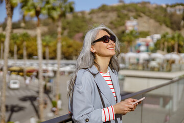 Happy and healthy woman enjoying good day outdoors