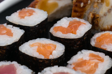 classic rolls with red fish, close-up background
