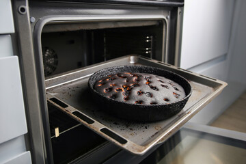 Burnt pie in the oven.