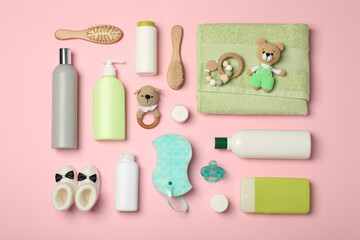 Flat lay composition with baby cosmetic products on pink background