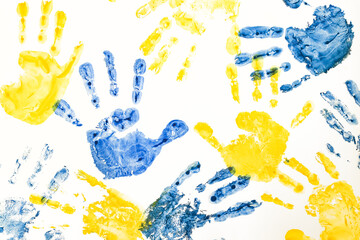 Ukrainian children against war. children's handprints ukrainian colors blue yellow pattern