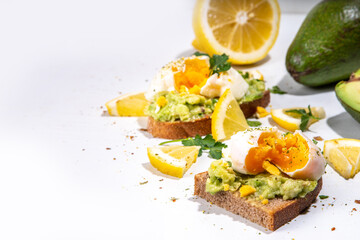Healthy diet sandwiches for breakfast, snack. Toast with guacamole avocado salsa and poached egg 