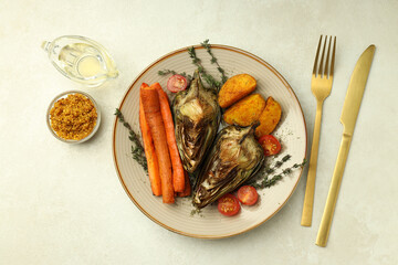 Concept of tasty food with grilled artichoke, top view