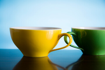 yellow and green tea cups 