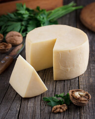 Types of cheese on wooden table