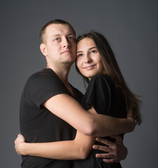 
close-up portrait of a pair of beautiful young guys and girls with a range of emotions and views on a dark background