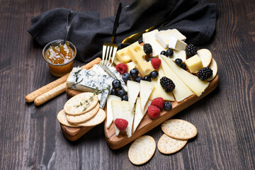 Сheese plate with gorgonzola parmesan brie or camembert and maasdam. served with berries and...