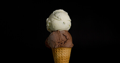 Ice Cream Ruammitr Coconut Flavoured on top ice cream Chocolate cone isolated on black background.