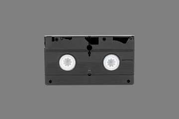 VHS videotape is isolated on a gray background rear view