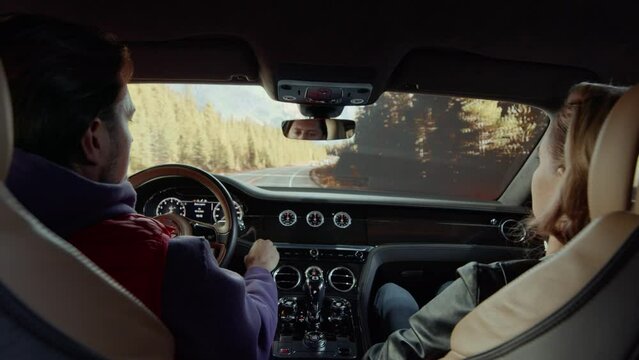 The driver of the Bentley switched the time on the control panel to the map, on the forest highway