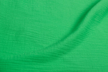 Muslin cloth texture background in neutral tones. Muslin cotton fabric of plain weave. Muslin is a soft, woven, 100-percent cotton multi-layer cloth popular for baby cloths and blankets