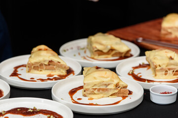 Francesinha, traditional Portuguese sandwich originally from Porto. National cuisine concept. the chef prepares a dish at restaurant