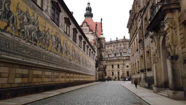 Cobblestone Street in Dresden Old Town next to Procession of Princes Mural
